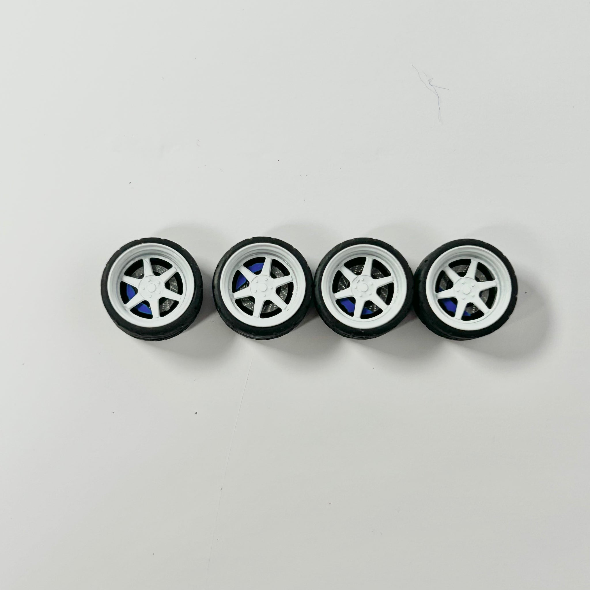 NEW- 10mm White w/ Blue Caliper TE37 “Vortex” Alloy Bearing Wheels. (Spinner)