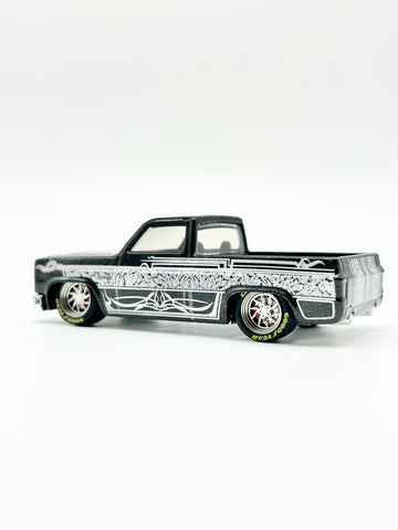Custom Black 83 Chevy Silverado with 12mm Alloy Spinner Wheels