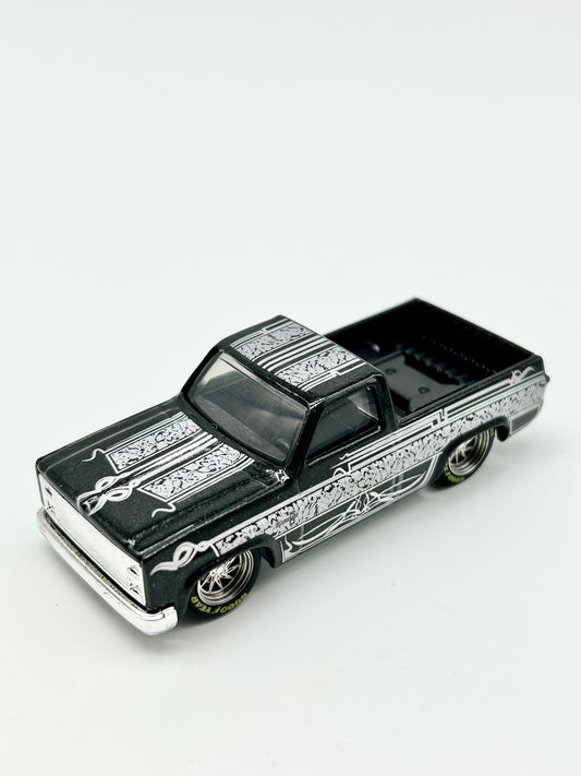 Custom Black 83 Chevy Silverado with 12mm Alloy Spinner Wheels