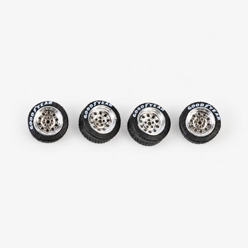 Four chrome Dots-style miniature wheels with black lettered tires