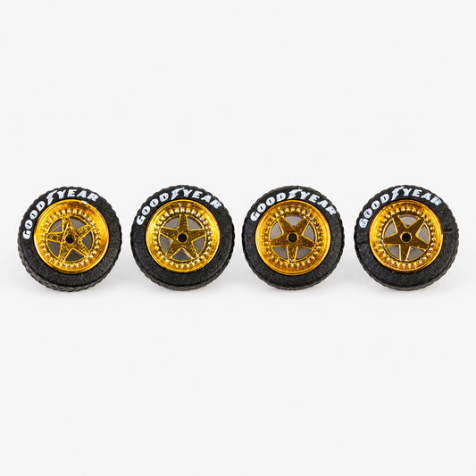 Four gold five-spoke Porsche-style miniature wheels with black lettered tires