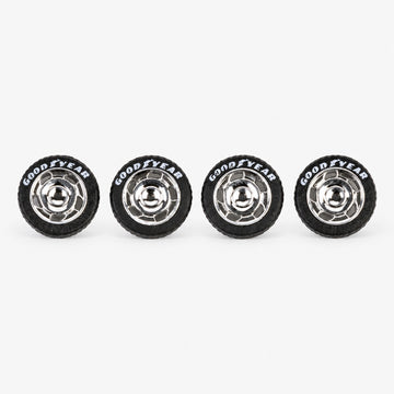 Four chrome VW-style miniature wheels with black lettered tires