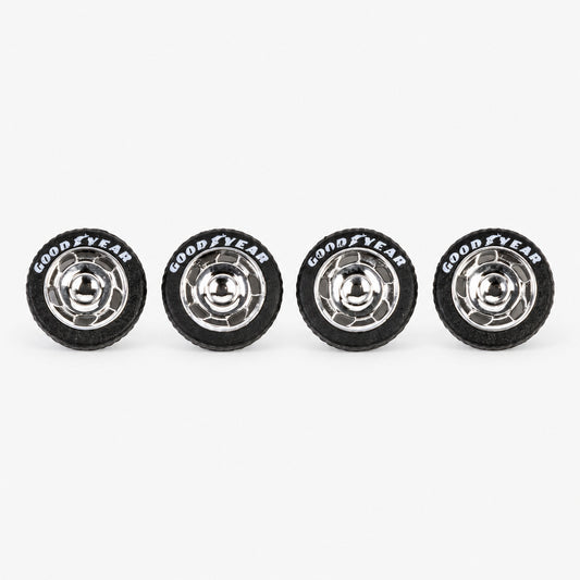 Four chrome VW-style miniature wheels with black lettered tires
