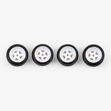 Four white five-spoke miniature wheels with black low-profile tires