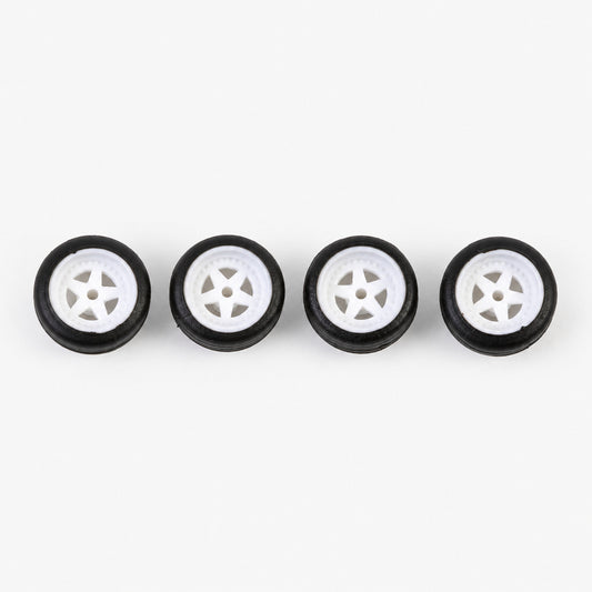 Four white five-spoke miniature wheels with black low-profile tires