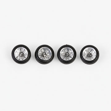 Four chrome ten-spoke deep-dish miniature wheels with black low-profile tires