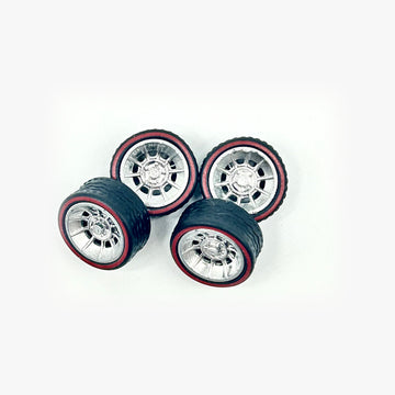 Four chrome Gen Lee-style miniature wheels with black tires and red sidewall rings