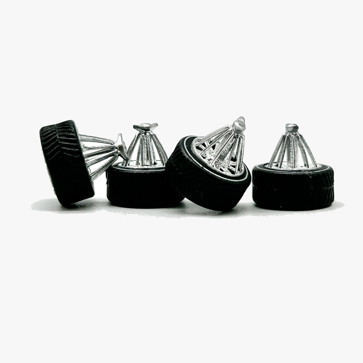 Four chrome Houston-style Swanga miniature wheels with black specialty tires