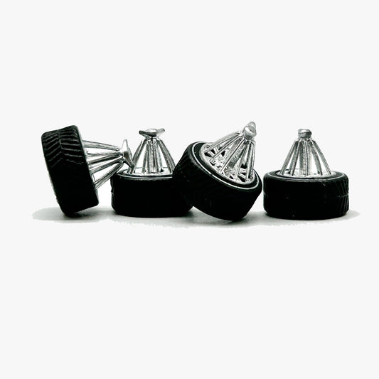 Four chrome Houston-style Swanga miniature wheels with black specialty tires