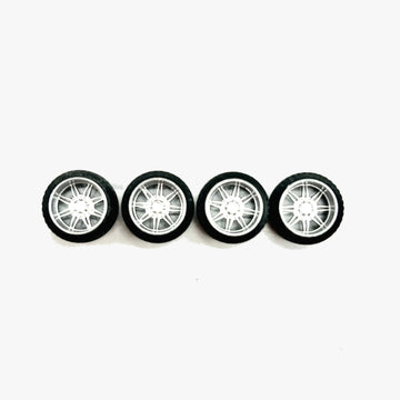 Four chrome KG1 Aristo miniature truck wheels with black RT tires