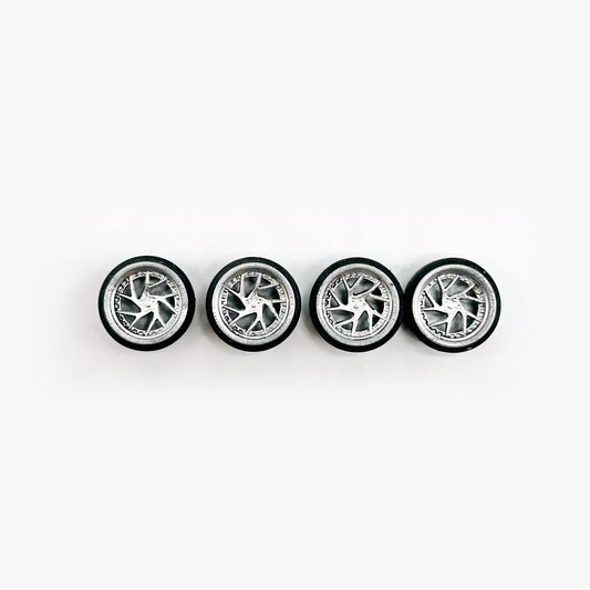 Four chrome Rucci Mega staggered miniature wheels with black tires