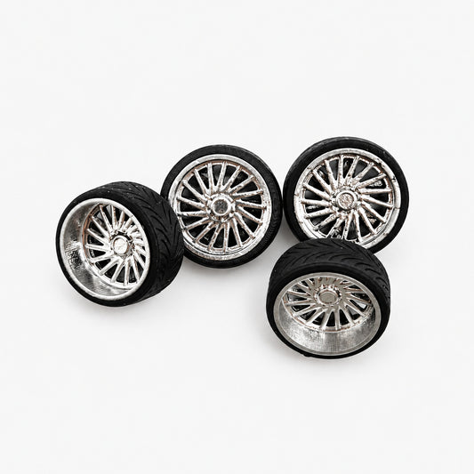 Four chrome Ventoso multi-spoke miniature wheels with black tires